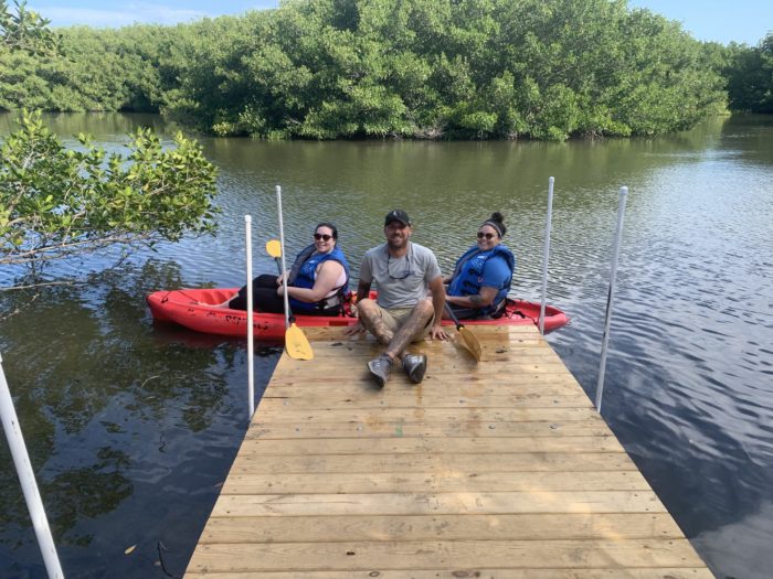 Chad with guests renting a tandem kayak