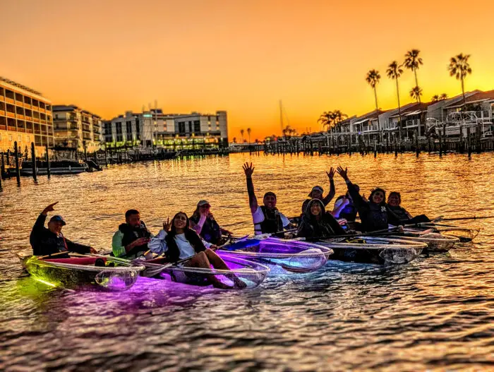group-on-led-light-kayaks-waving-gloflo-kayaking-toursjpg - Chadillac Adventures