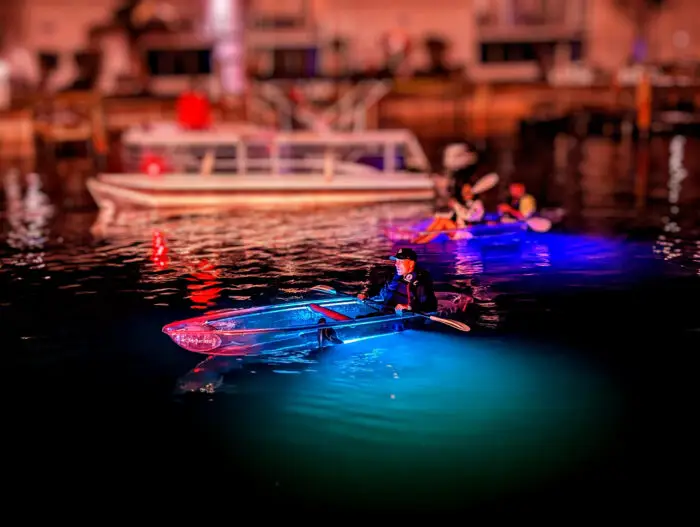 kayaker-in-foreground-with-boat-in-backgroundjpg - Chadillac Adventures